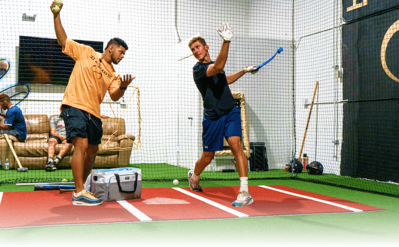 two men at hitting coaching lesson at Infinite Hitting